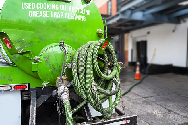 heavy-duty grease trap pumping equipment in action in Empire